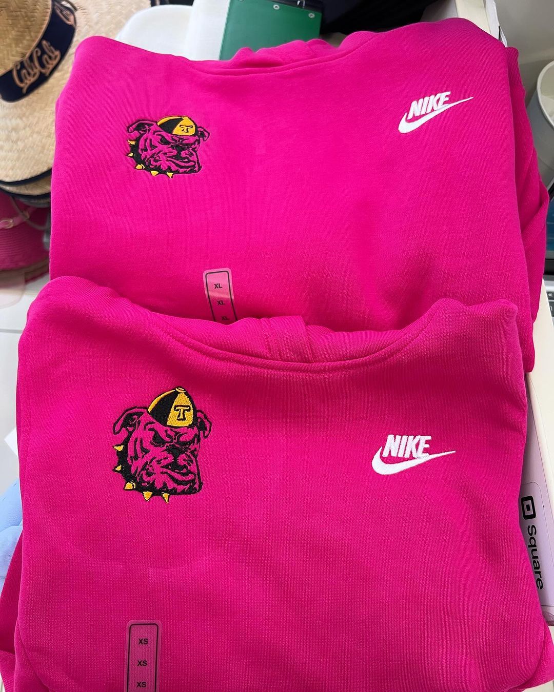 Bulldog mascot embroidered on pink hoodies